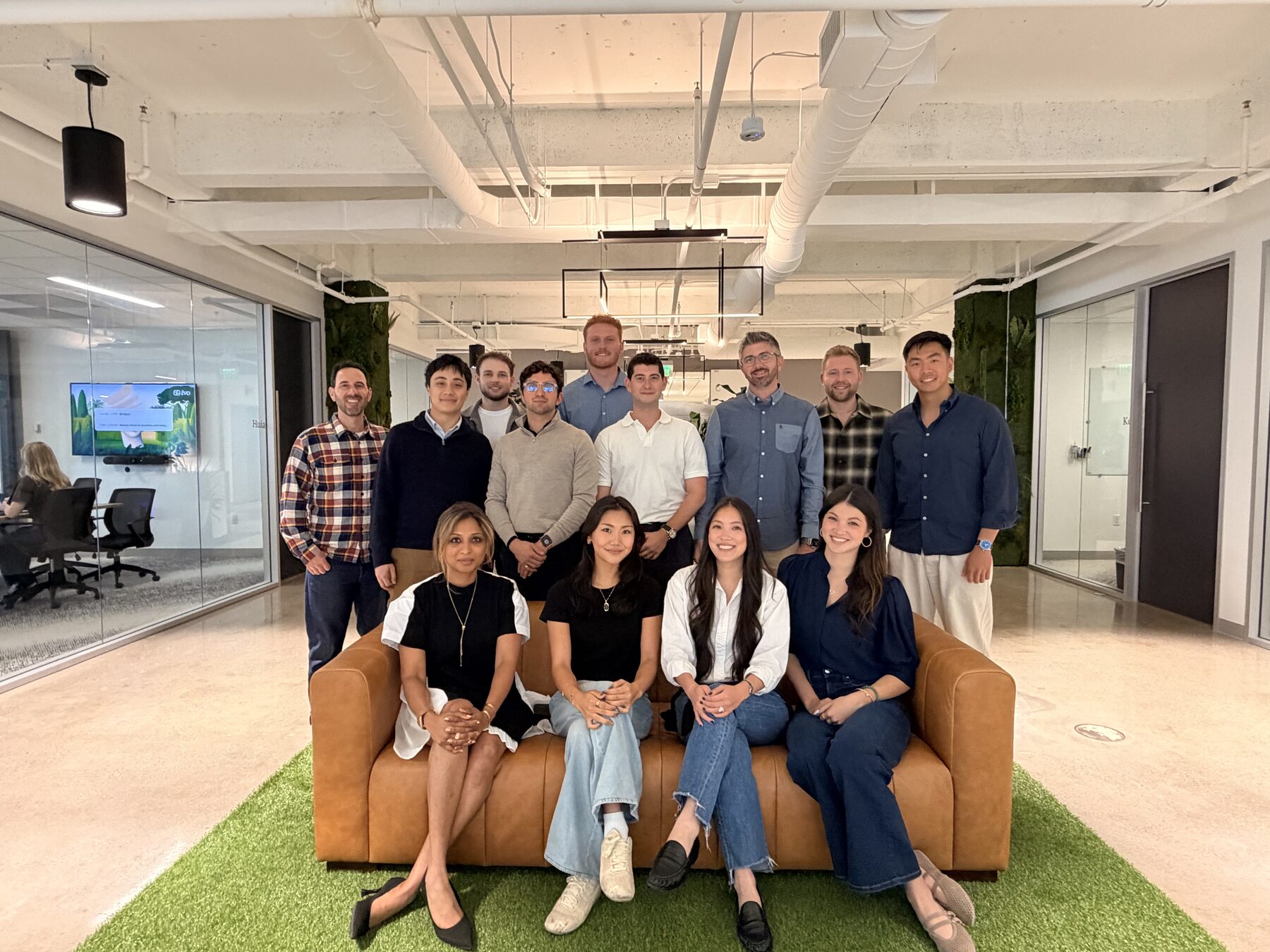 The new class of hires, gathered in the office